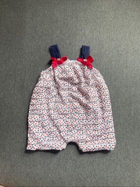 Little Lass White Star-Print Romper with Navy Straps and Red Bows